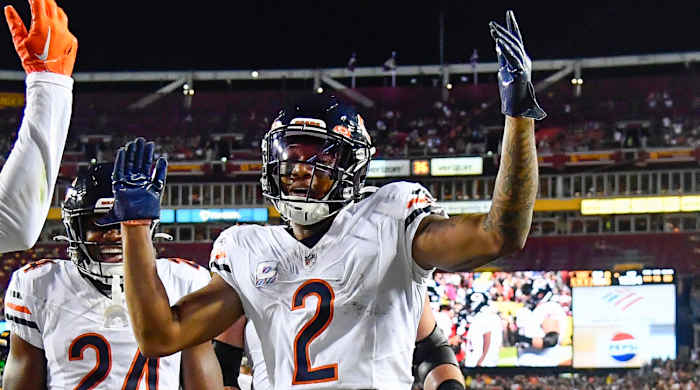Bears receiver DJ Moore celebrates scoring a touchdown with his teammates.